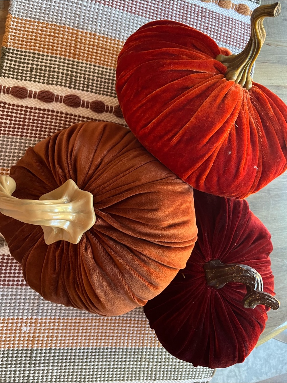 Three pumpkins: orange, rust,brown in velvet like material. All like new